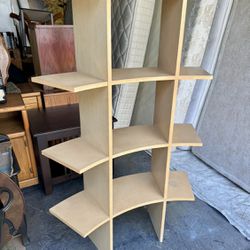 Curved maple color wood triple wide 3-layer shelf bookcase. Measurements:  39W x  12 deep x 61H. 
