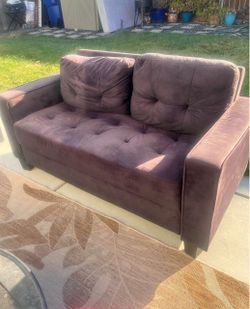 Beautiful red loveseat.