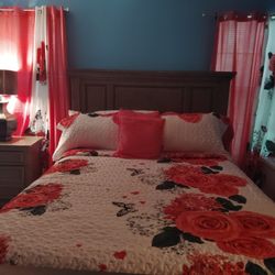 Bed, Lamp, And a dresser with a large mirror