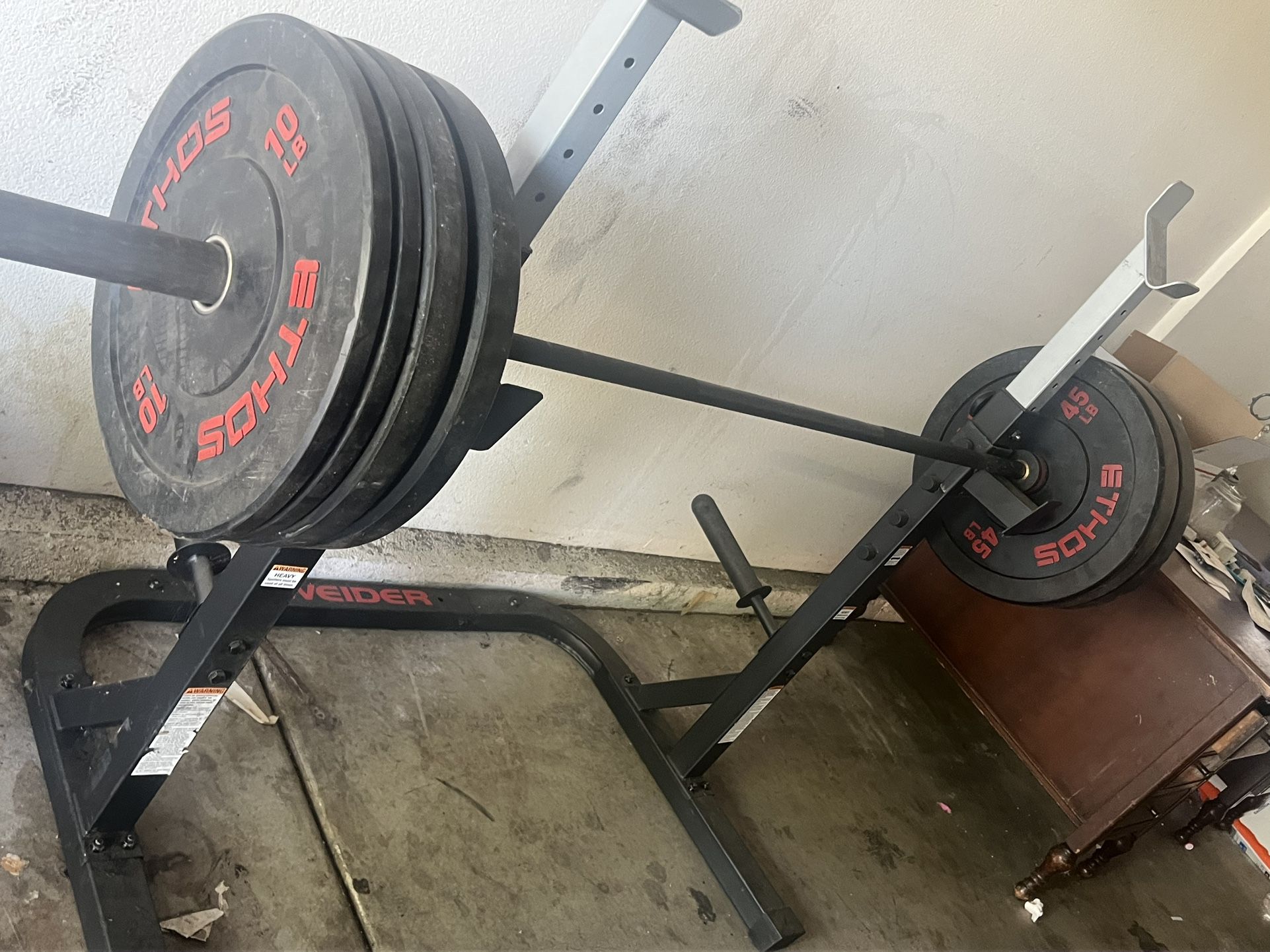 Weights, Bar Bell and Squat Rack.