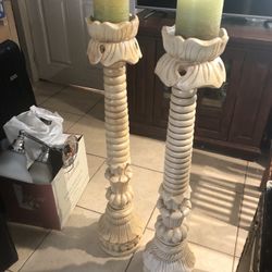 Two Candles With Long Holders 