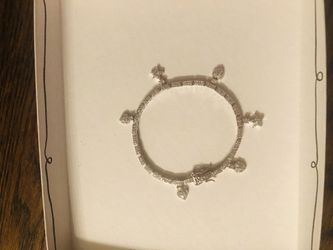 Women’s silver and diamond charm bracelet