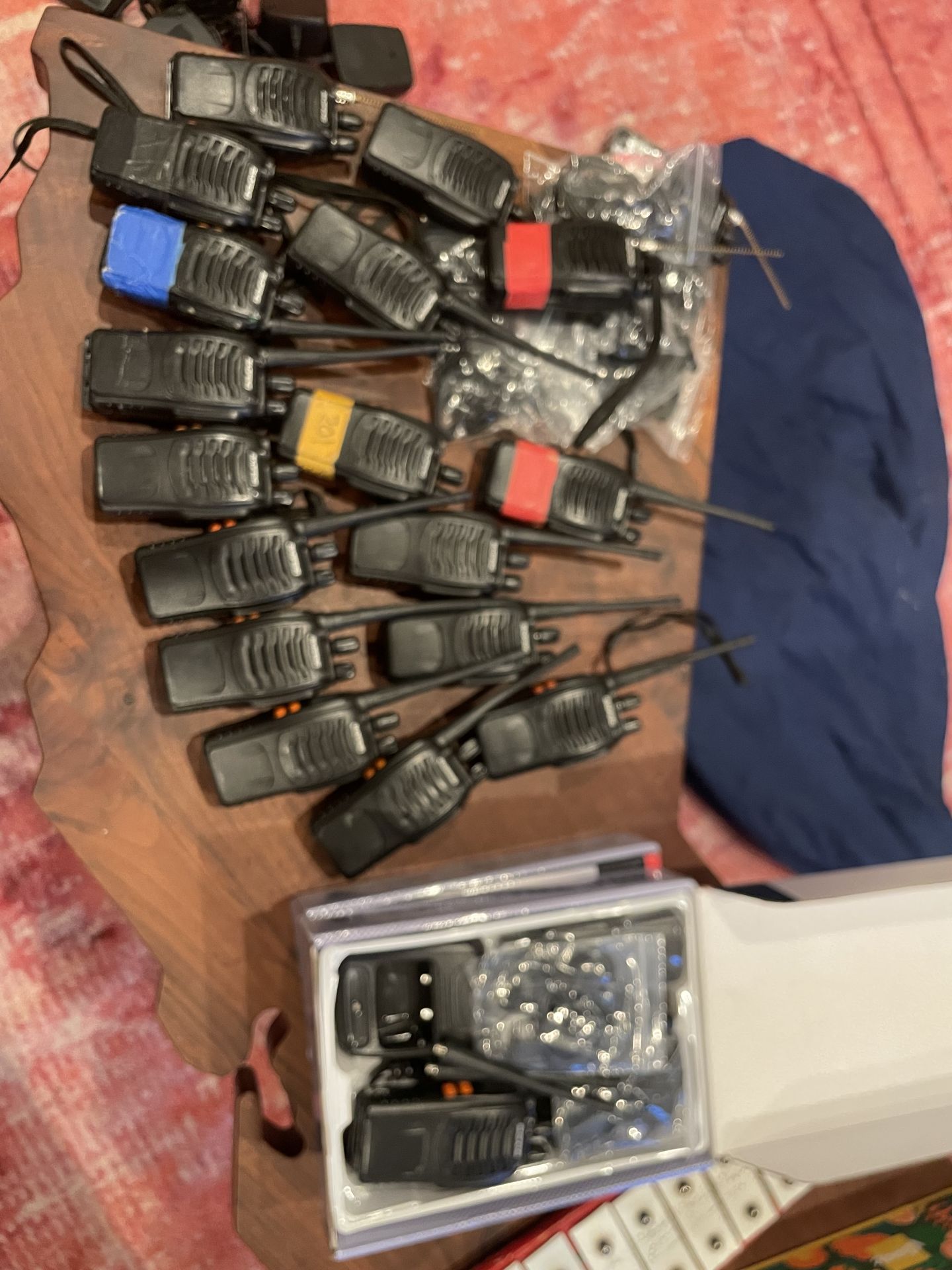 Over 20 walkie talkies with clips and chargers and new ear pieces