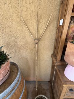 Antique wooden hay fork, also known as a pitchfork. 