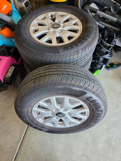 4 used tires amd wheels  ( 2026 Toyota tacoma)