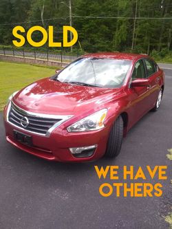 2013 Nissan Altima with low 62.000 miles in excellent looking and running condition