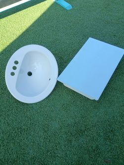 Bathroom sink and medicine cabinet
