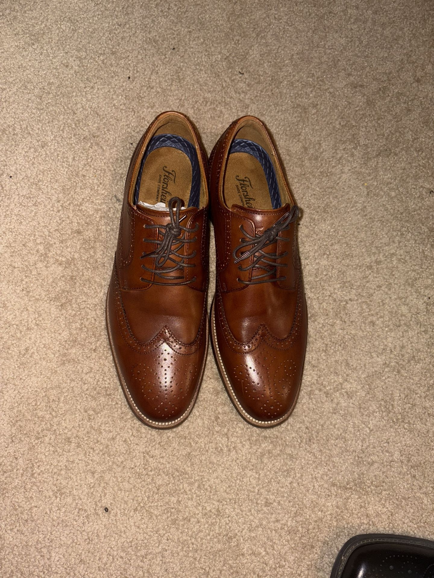 Dress Shoes And Books And Belts