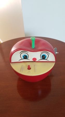 Vintage toy apple mechanical bank.