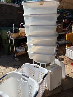 Assorted Plastic Containers And Baskets For Clothes