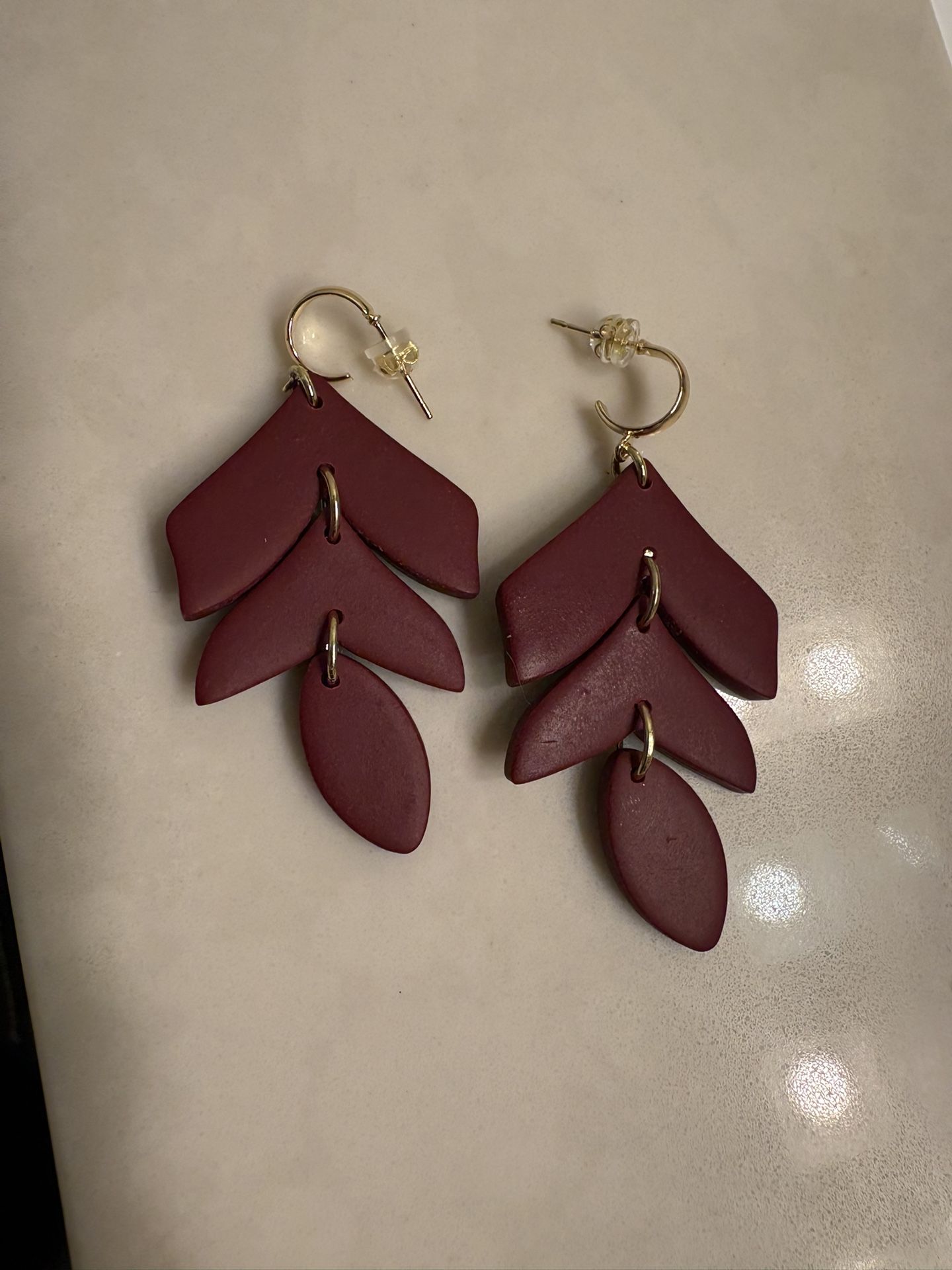 Brand new pair of handmade polymer clay leaf dangle maroon earrings