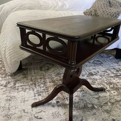 mahogany lyre harp table with brass claw feet.