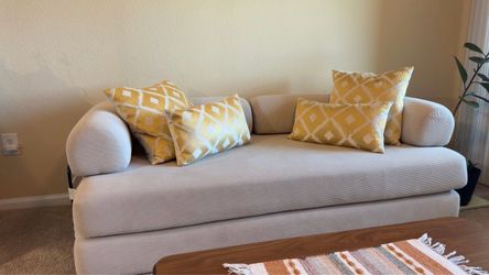 Cream/Beige couch and pillows