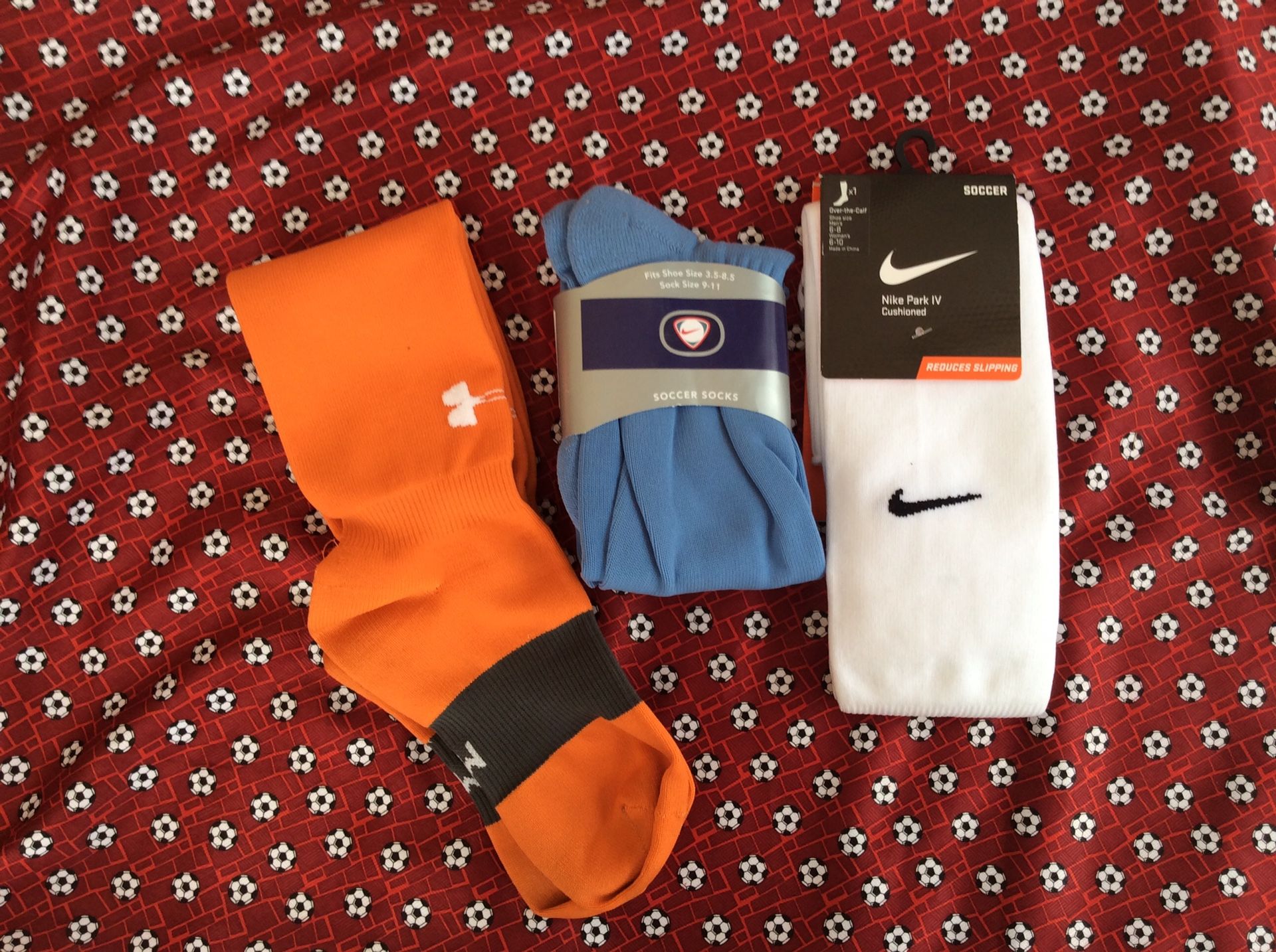 Nike and under armour soccer socks. Medium