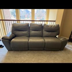 Free Grey Leather Couch. Reclines On Both Ends. Ends Need Work.