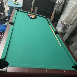 Pool Table with Balls and Cue Stick