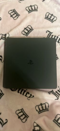 PlayStation 4 with two controllers