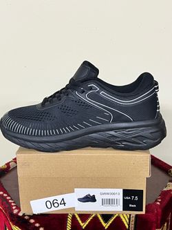 G WEST, size 7.5, black and grey shoes.