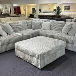 By Ashley    Alloy 3-Piece Sectional with Ottoman
