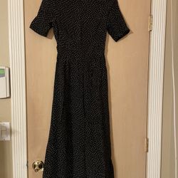 Brand New size Xs women’s black and white polka dot romper. Small open back. Button up neck 