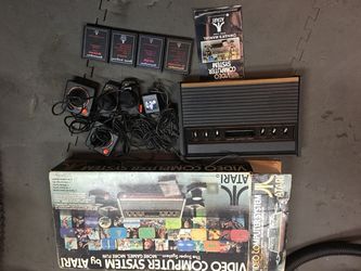 Original 1977 Atari wood grain 4 games etc..