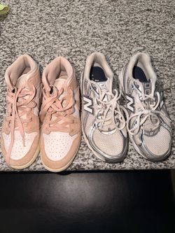 Pink Nike dunks and new balance shoes