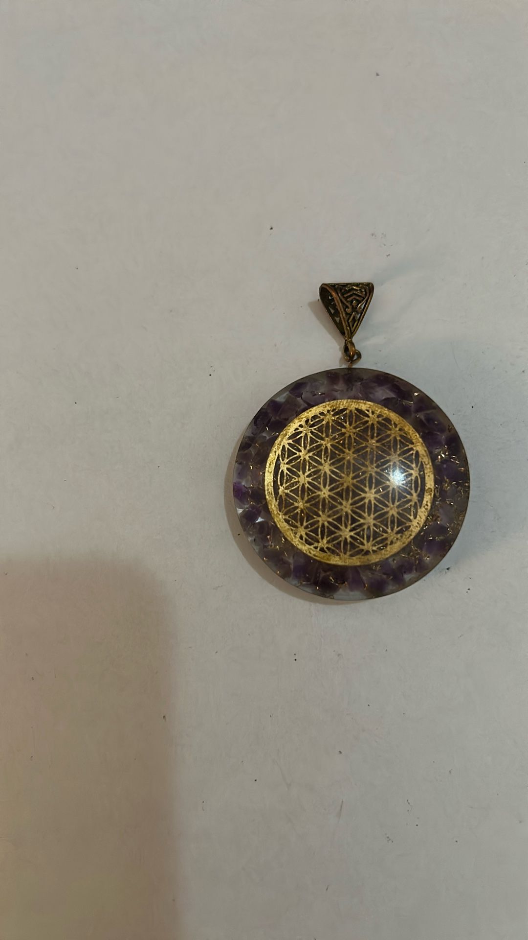 Amethyst pendant with symbol