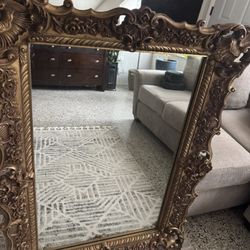 HEAVY ornate mirror