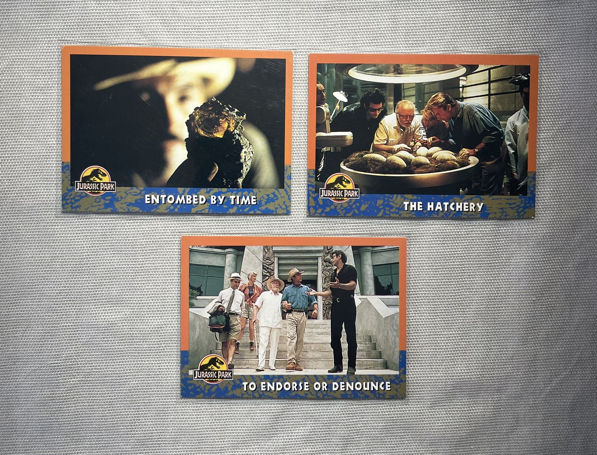 π₯β€οΈπ¦ 1993 Jurassic Park (3) Card Lot - Topps Trading Cards - Entombed by Time, The Hatchery and To Endorse Or Denounce π¦β€οΈπ₯