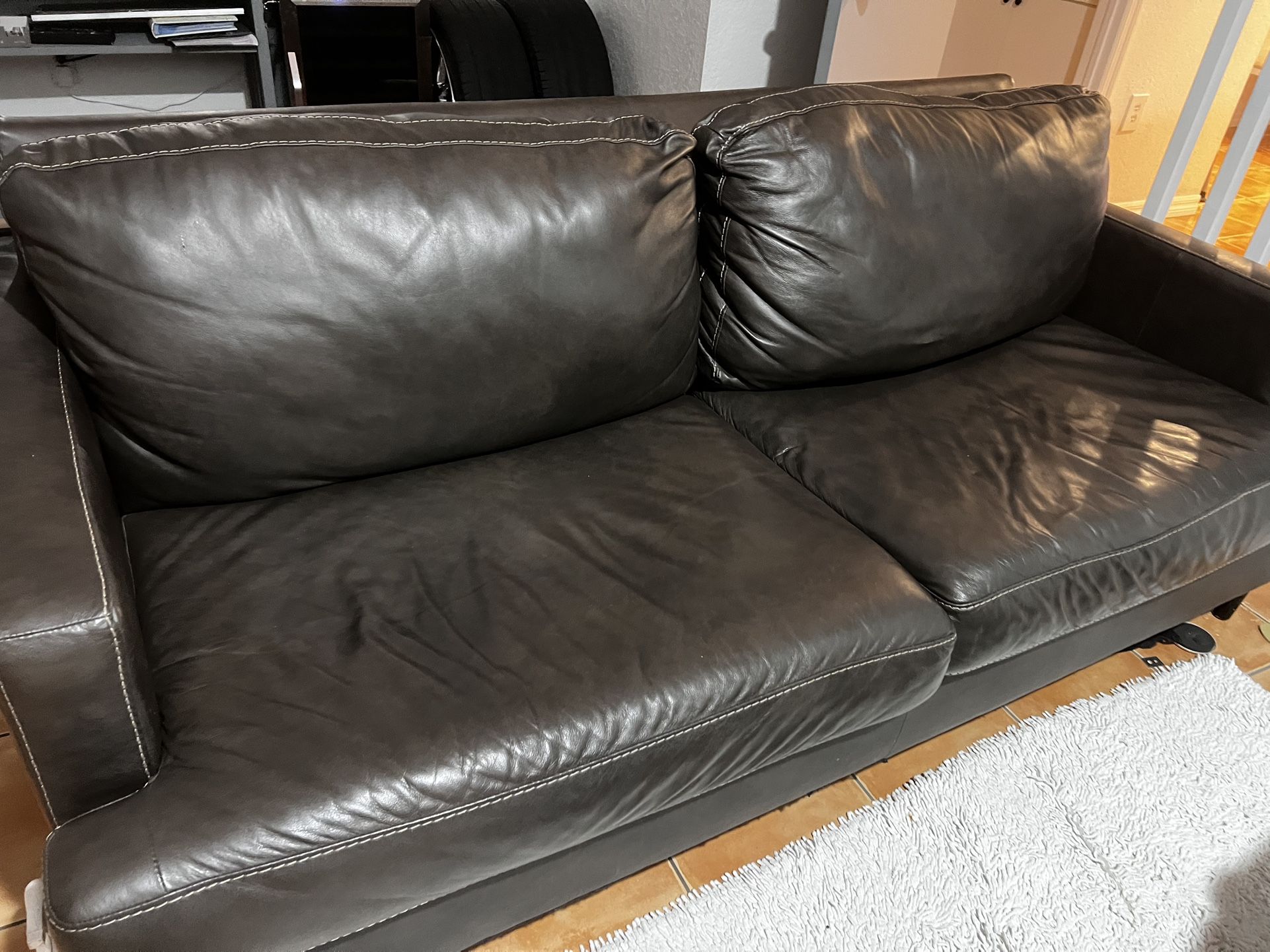 Brown Leather Loveseat – $200