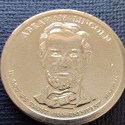 2-Presidential Gold Tone Coins Abraham Lincoln & Rutherford Hayes In Very Good Circulated Condition.