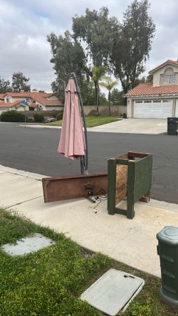 Large patio umbrella and scrap wood