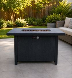 Outdoor fire pit table with lava rocks
