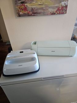 CRICUT EXPLORER 3 AND A CRICUT EASYPRESS 3.