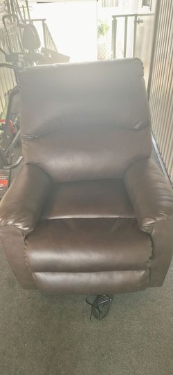 Recliner leather by Ashley.  Model shadow boxer#(contact info removed)
