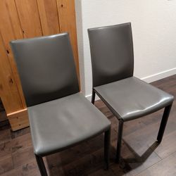 Two Crate And Barrel Leather Dining Chairs