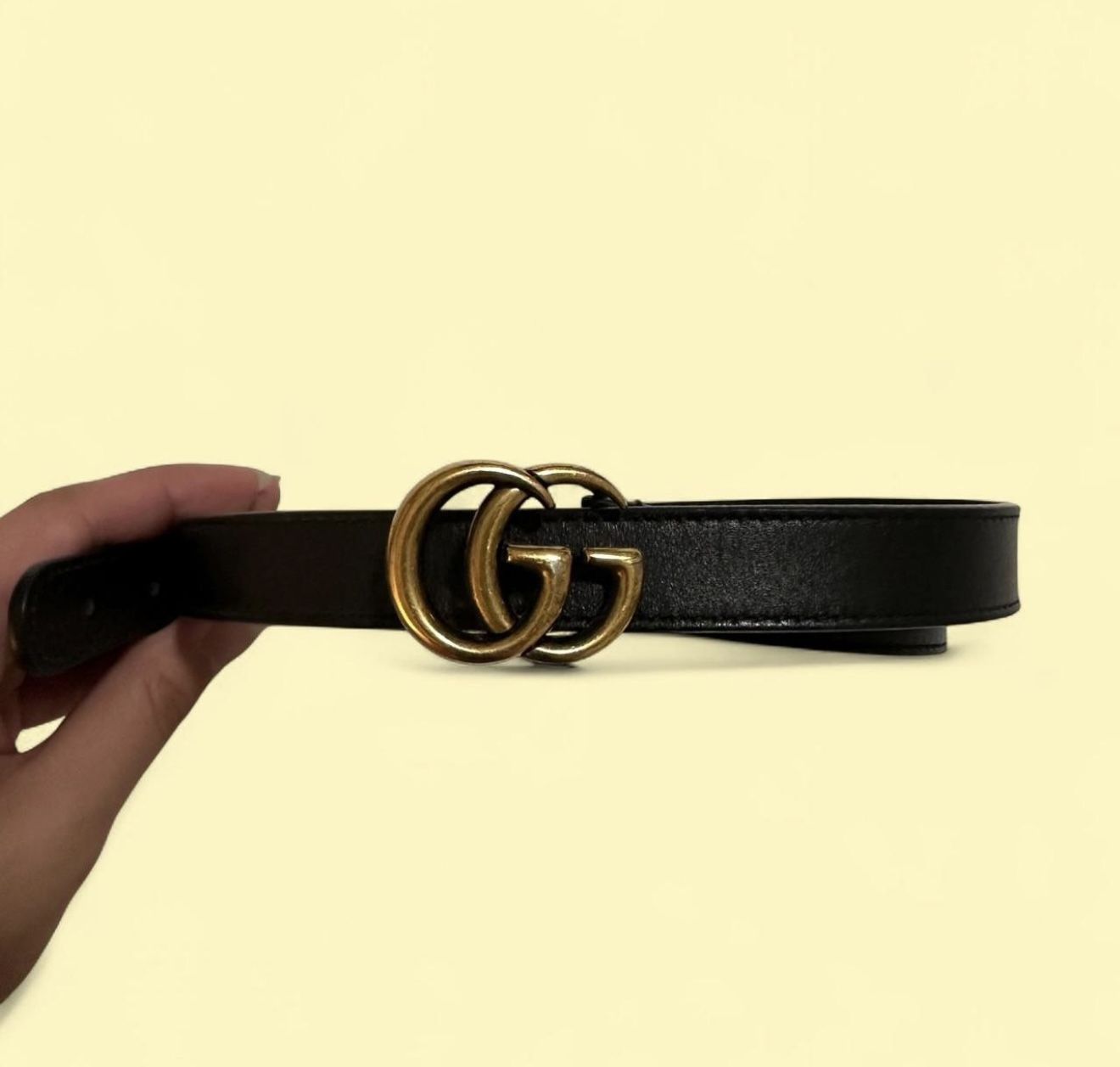 Size 26 Gucci GG belt. Fits waist size 23-28. This belt is authentic and in amazing condition. This is my personal belt that I stamped extra holes in,