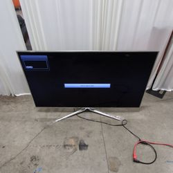 Samsung Modern Black Flat-Screen TV with Silver Stand