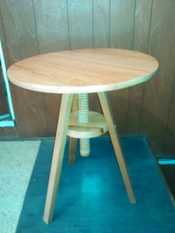 Adjustable height round all wood table