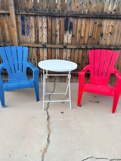 Set of 2 chairs with polypropylene frames and a 2.6 ft round folding table.