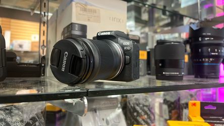 Canon R10 with 18-150mm.  Open box