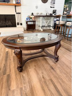 Ashley’s wooden and glass top coffee table