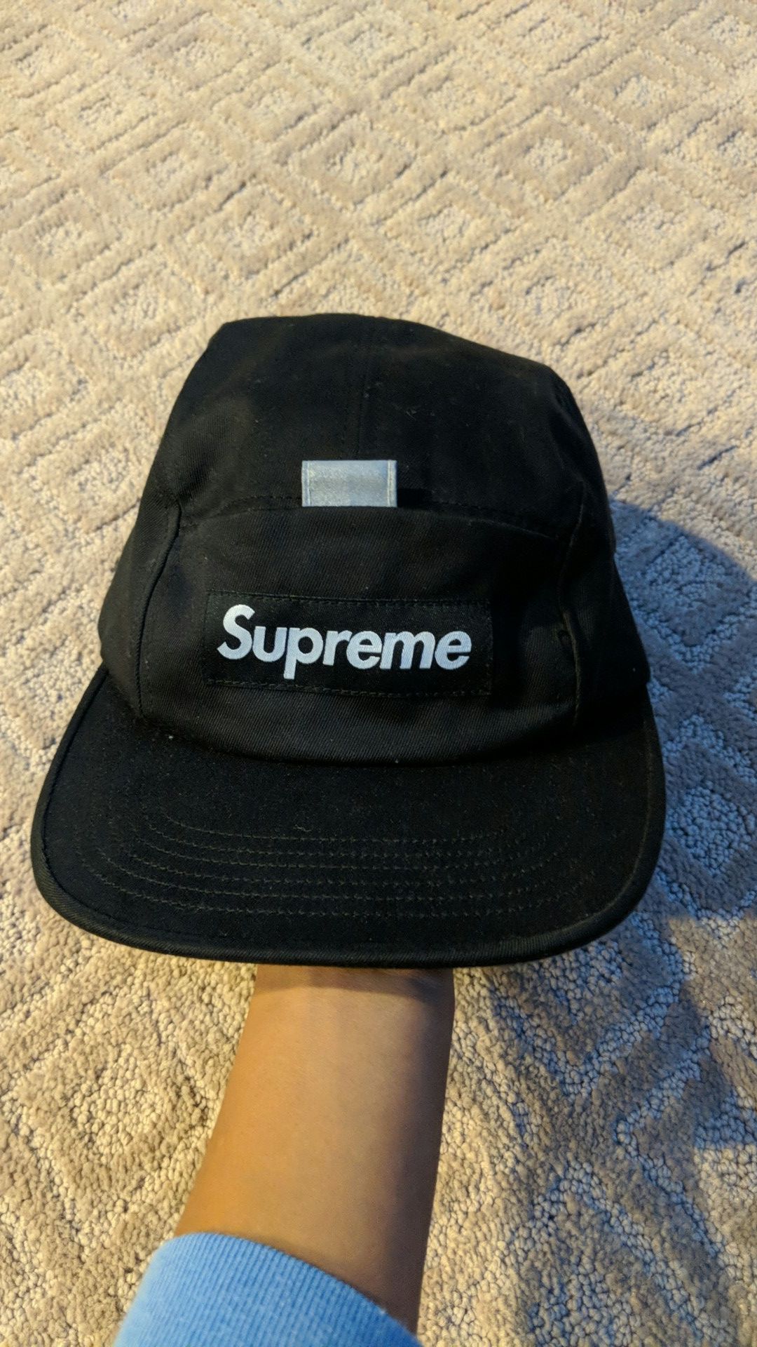 Black Supreme hat tried on