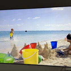Tv 70” 4K with Stand Included.
