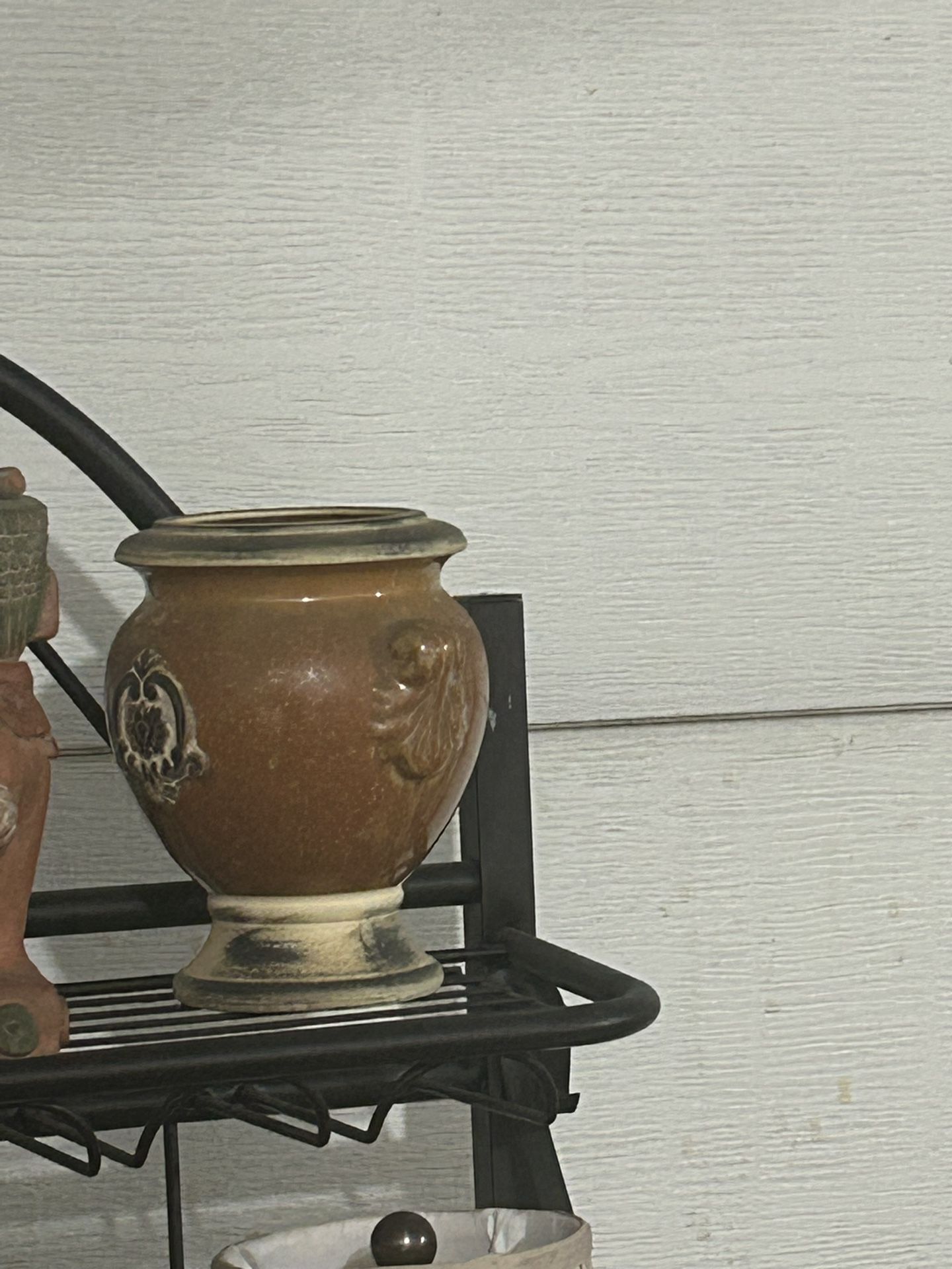Hosley Potteries brown and tan urn-footed ceramic planter or vase. It features a rustic, Victorian-style pattern with a brown, crackled drip glaze fi