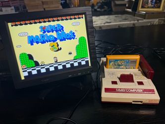 Famicom game console with Super Mario Bros 3