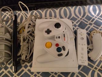 Nintendo Wii Console + Family Games