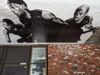 This is a 2012 Olympics stadium banner with Kobe Bryant LeBron James and Kevin Barrett