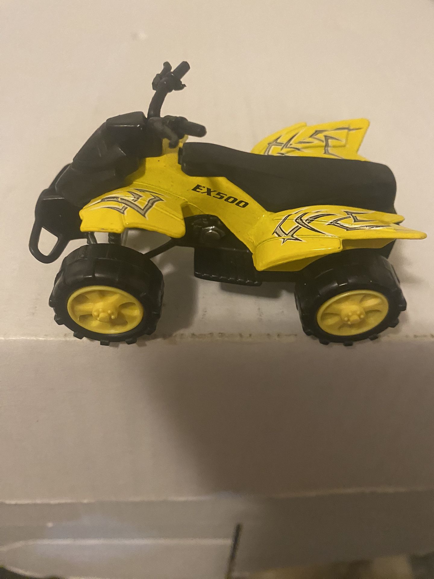 Yellow toy ATV