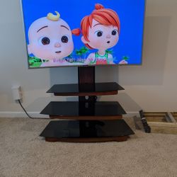 55" curved TV and stand.  Roku system. h